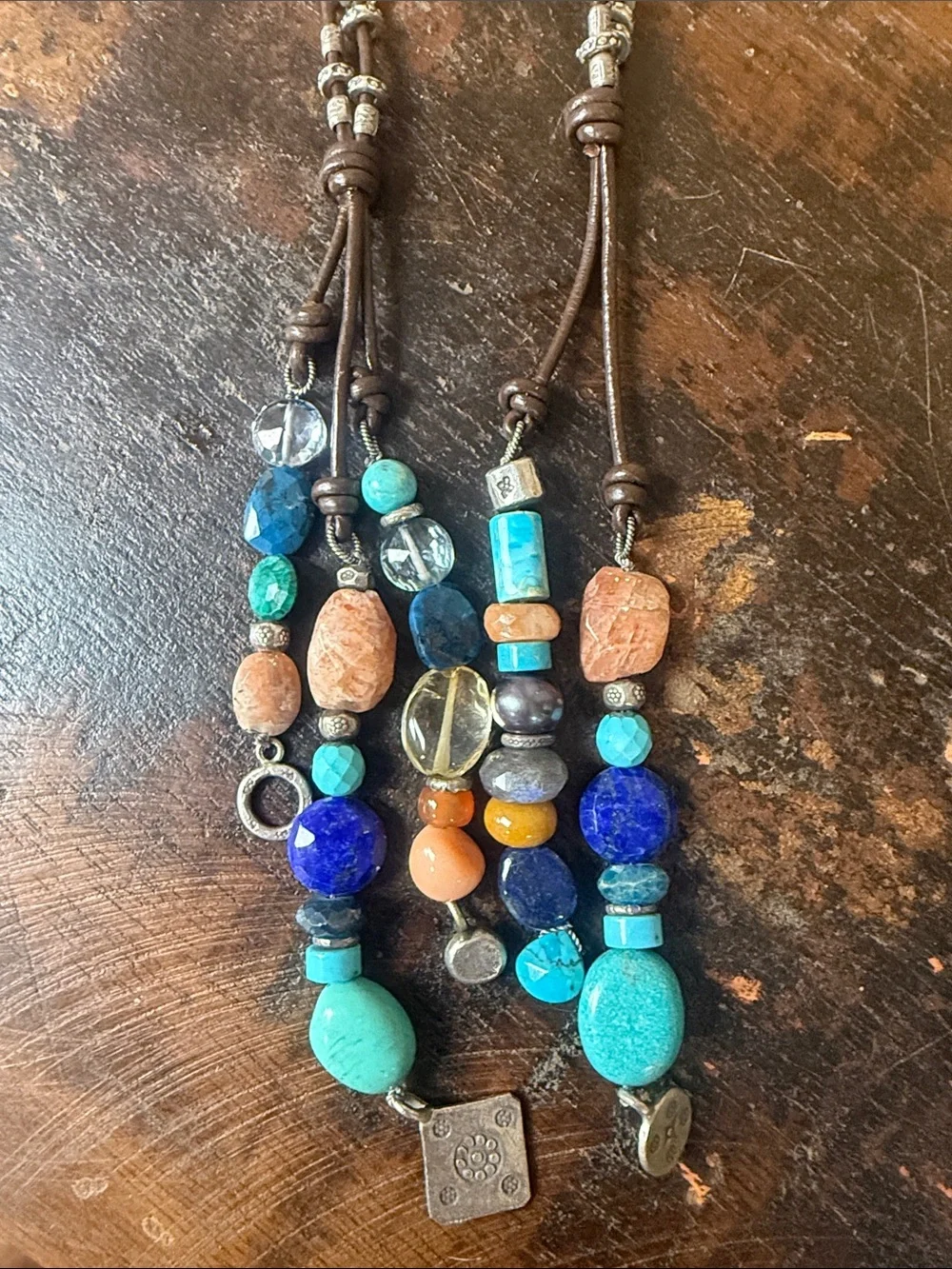 5 tassel lariat leather cord necklace. New with tags from Sundance.